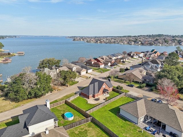 bird's eye view with a water view and a residential view