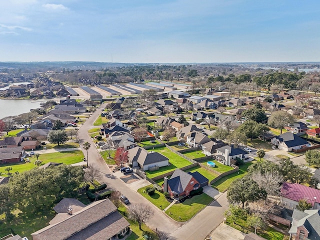 birds eye view of property with a residential view and a water view