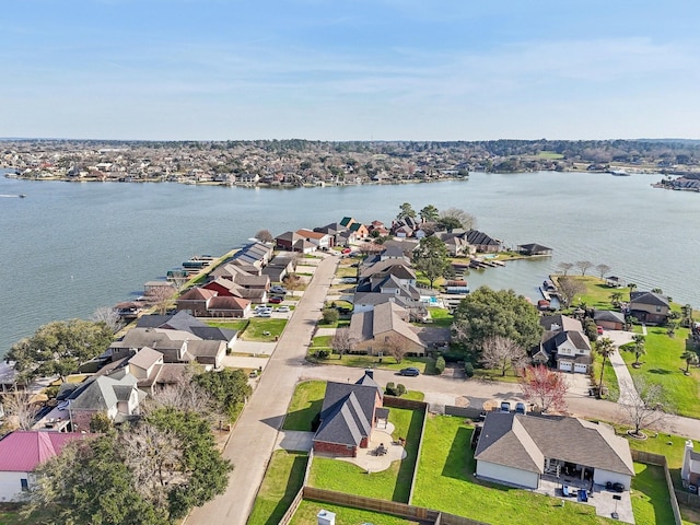 aerial view featuring a residential view and a water view