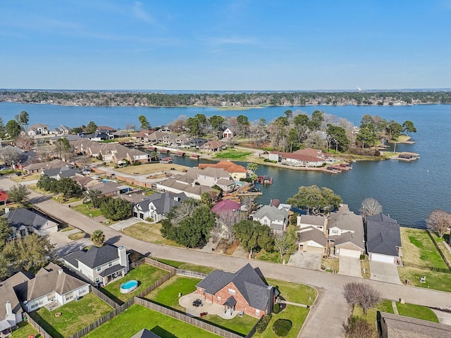 bird's eye view with a water view and a residential view