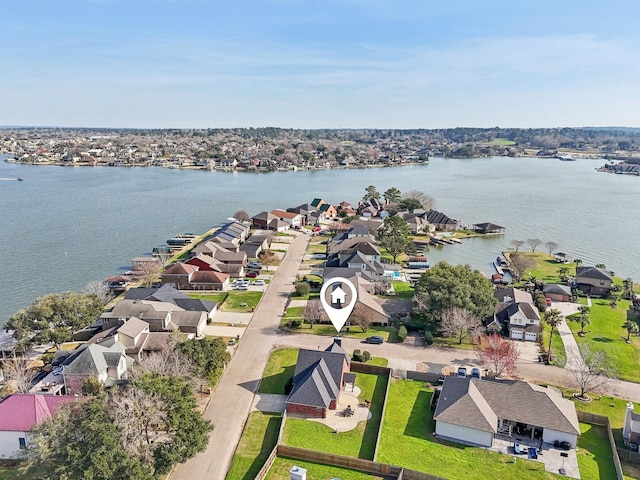 birds eye view of property with a residential view and a water view