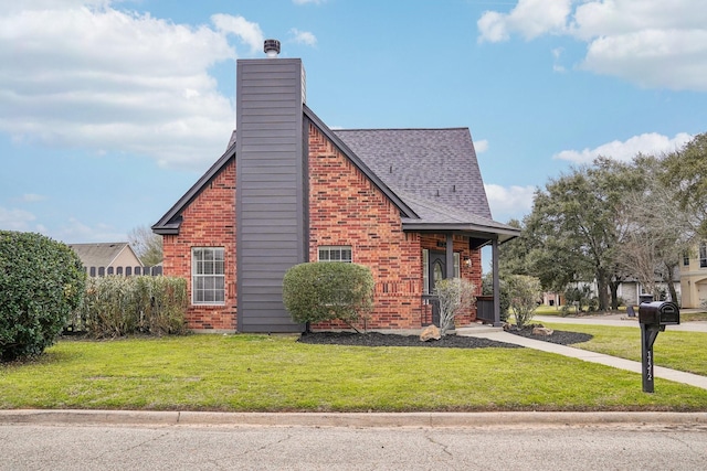 view of side of property with roof with shingles, a chimney, a lawn, and brick siding