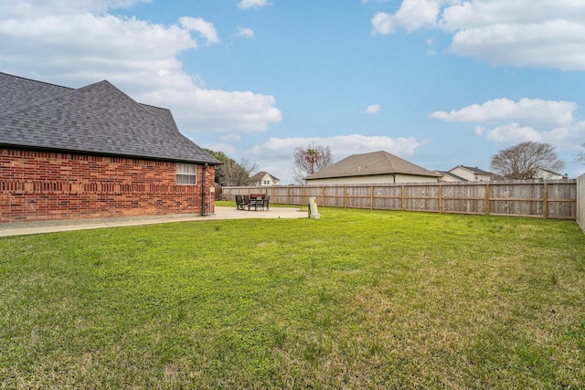 view of yard featuring a patio area and a fenced backyard