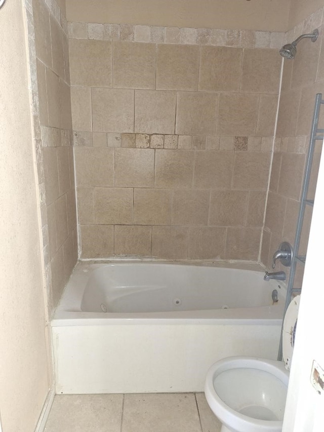 full bathroom featuring  shower combination, tile patterned flooring, and toilet