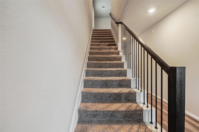 stairs featuring baseboards