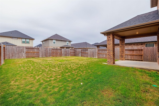 view of yard featuring a patio area and a fenced backyard