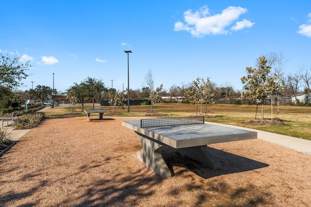 view of home's community with a yard