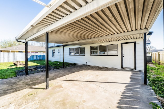 view of patio featuring central AC and fence