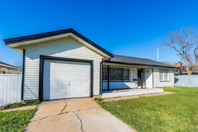 ranch-style house featuring a garage, driveway, a front yard, and fence