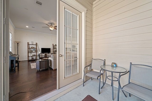 balcony with a patio area and visible vents