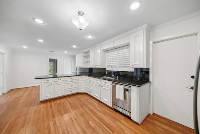 kitchen featuring a peninsula, a sink, white cabinetry, open shelves, and stainless steel dishwasher