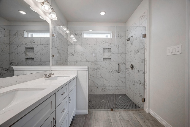 24690 Galway St, Hempstead, TX 77445 - full bath featuring double vanity, wood finished floors, a stall shower, and a sink