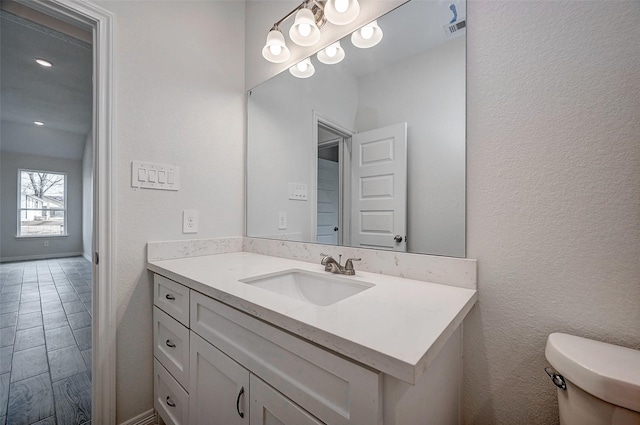 24690 Galway St, Hempstead, TX 77445 - bathroom featuring a textured wall, vanity, and toilet