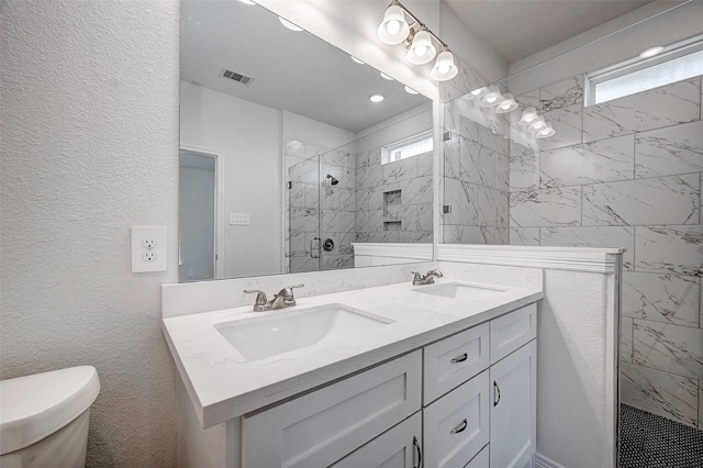 24690 Galway St, Hempstead, TX 77445 - full bath featuring double vanity, a stall shower, a sink, and visible vents