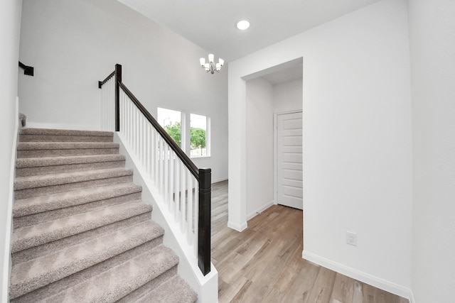 24727 Harrow Meadow Dr, Katy, TX 77493 - stairway with a chandelier, recessed lighting, baseboards, and wood finished floors