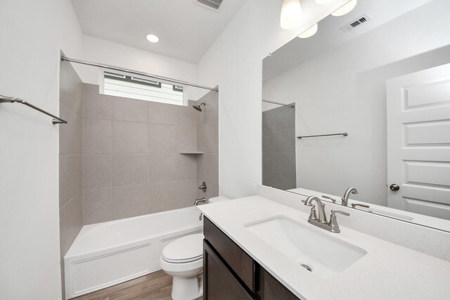 24727 Harrow Meadow Dr, Katy, TX 77493 - full bath featuring visible vents, shower / washtub combination, toilet, vanity, and wood finished floors