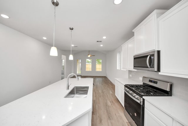 24727 Harrow Meadow Dr, Katy, TX 77493 - kitchen with a sink, light countertops, light wood-style floors, recessed lighting, and stainless steel appliances