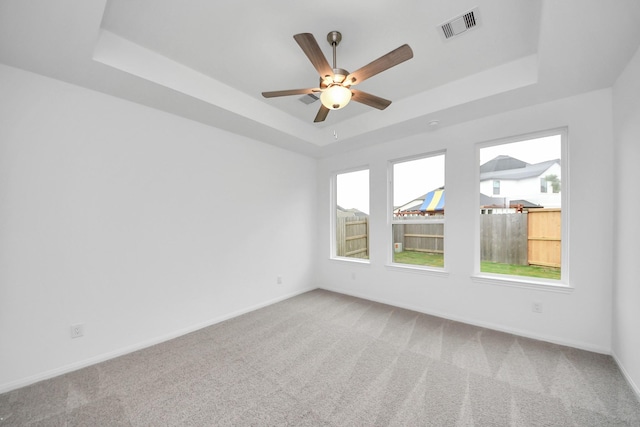 24727 Harrow Meadow Dr, Katy, TX 77493 - carpeted spare room featuring visible vents, baseboards, and a tray ceiling