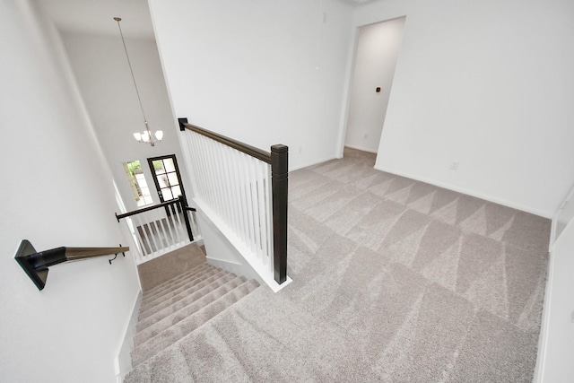 24727 Harrow Meadow Dr, Katy, TX 77493 - stairway featuring a chandelier, baseboards, and carpet floors