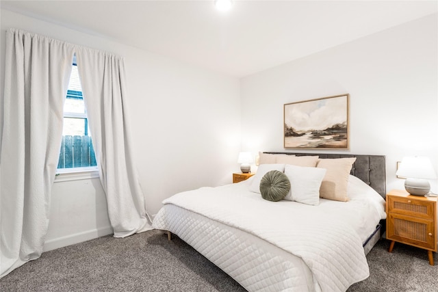 carpeted bedroom with baseboards