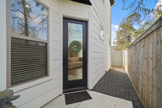 property entrance with fence