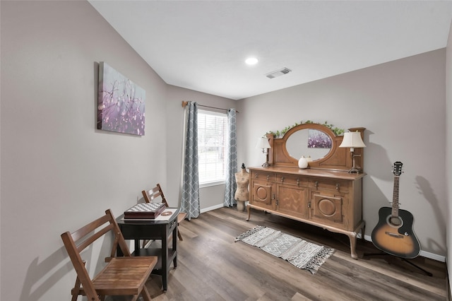 living area featuring recessed lighting, wood finished floors, visible vents, and baseboards