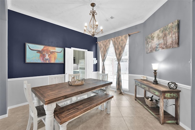 dining area featuring baseboards, visible vents, a notable chandelier, and light tile patterned flooring