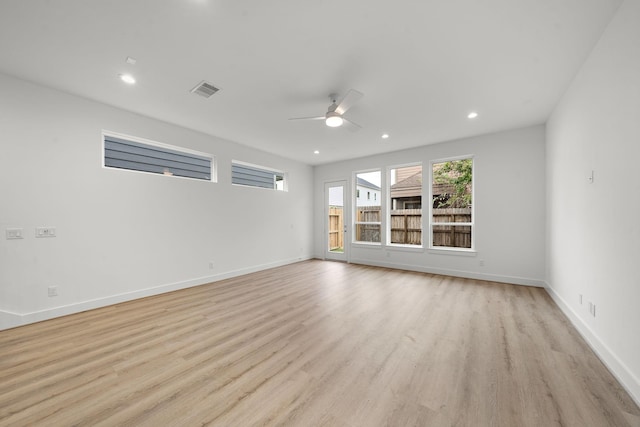 empty room featuring light wood-style flooring, baseboards, ceiling fan, and recessed lighting