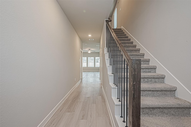 stairway with visible vents, baseboards, a ceiling fan, wood finished floors, and recessed lighting