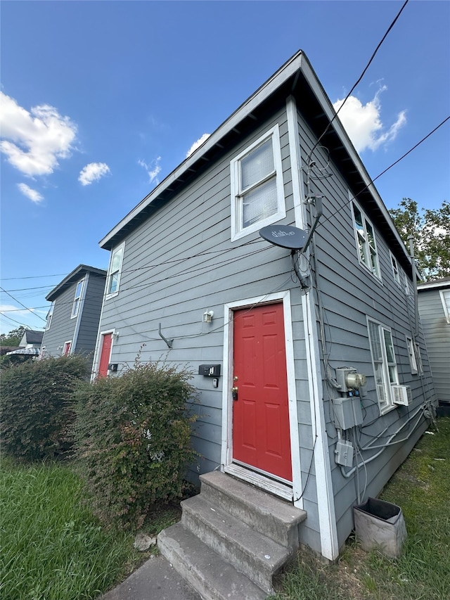 view of front of home featuring entry steps and cooling unit