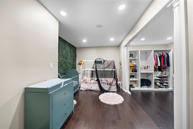 bedroom with recessed lighting and dark wood-style flooring