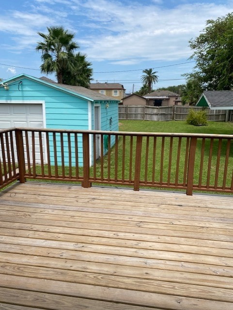 deck featuring fence and a lawn