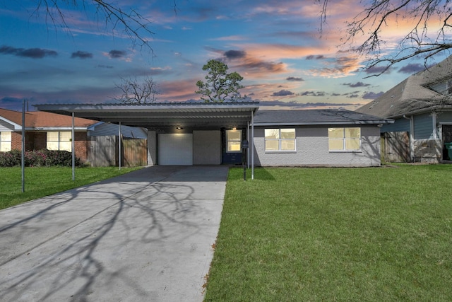 view of front of house featuring a carport, brick siding, a front yard, and fence