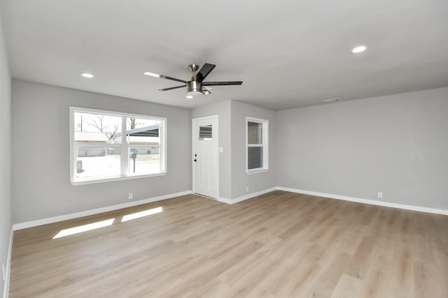 spare room with recessed lighting, visible vents, light wood-style floors, ceiling fan, and baseboards