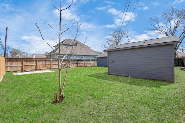 view of yard with a fenced backyard