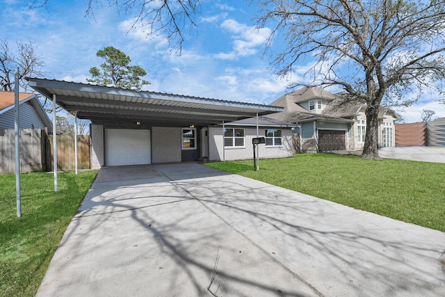 view of front of home featuring an attached garage, a front yard, fence, a carport, and driveway