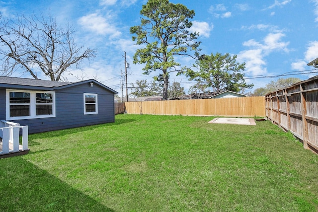 view of yard with a fenced backyard