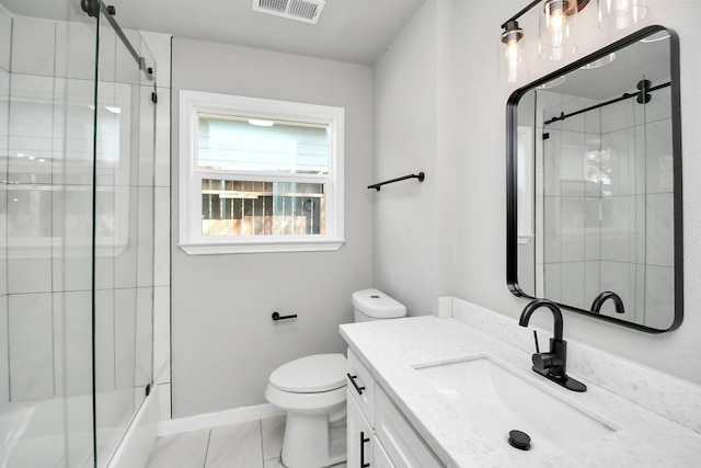 bathroom with baseboards, visible vents, toilet, shower / bath combination with glass door, and vanity