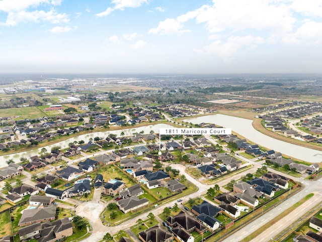 aerial view with a residential view and a water view