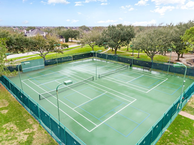 view of sport court with fence