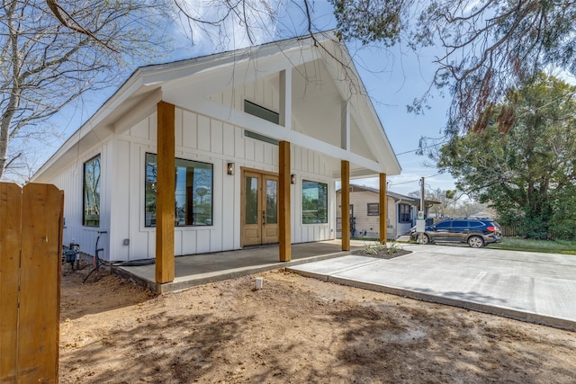 exterior space featuring french doors and board and batten siding