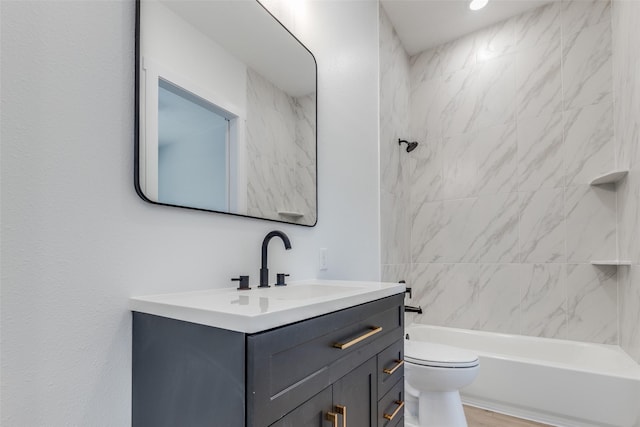 full bathroom featuring tub / shower combination, toilet, and vanity