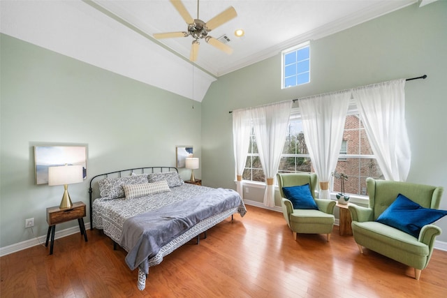 bedroom featuring high vaulted ceiling, wood finished floors, a ceiling fan, and baseboards