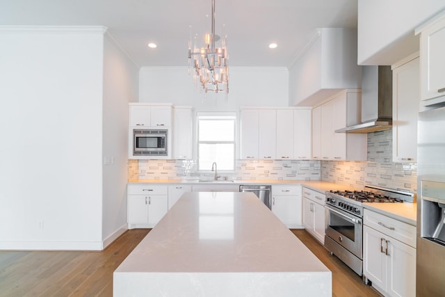 kitchen featuring light countertops, appliances with stainless steel finishes, and white cabinetry