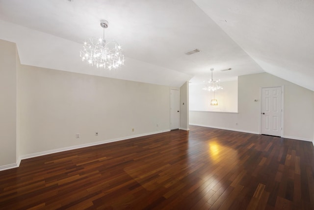 bonus room with lofted ceiling, visible vents, a chandelier, and dark wood-style flooring