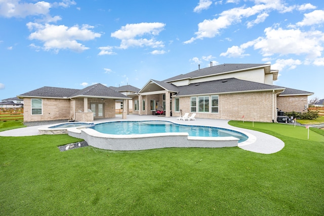 view of swimming pool with a pool with connected hot tub, a ceiling fan, and a patio