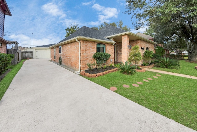 view of front of house featuring a garage, roof with shingles, a front lawn, and brick siding