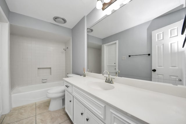 full bath featuring toilet, tile patterned flooring, bathing tub / shower combination, and vanity