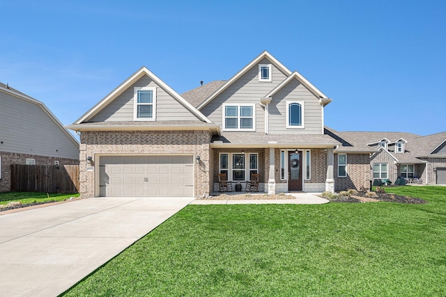 craftsman inspired home with a front yard, concrete driveway, brick siding, and fence