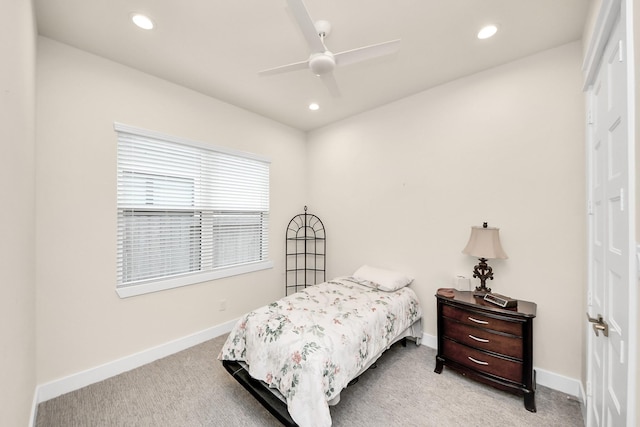 bedroom featuring recessed lighting, light colored carpet, and baseboards